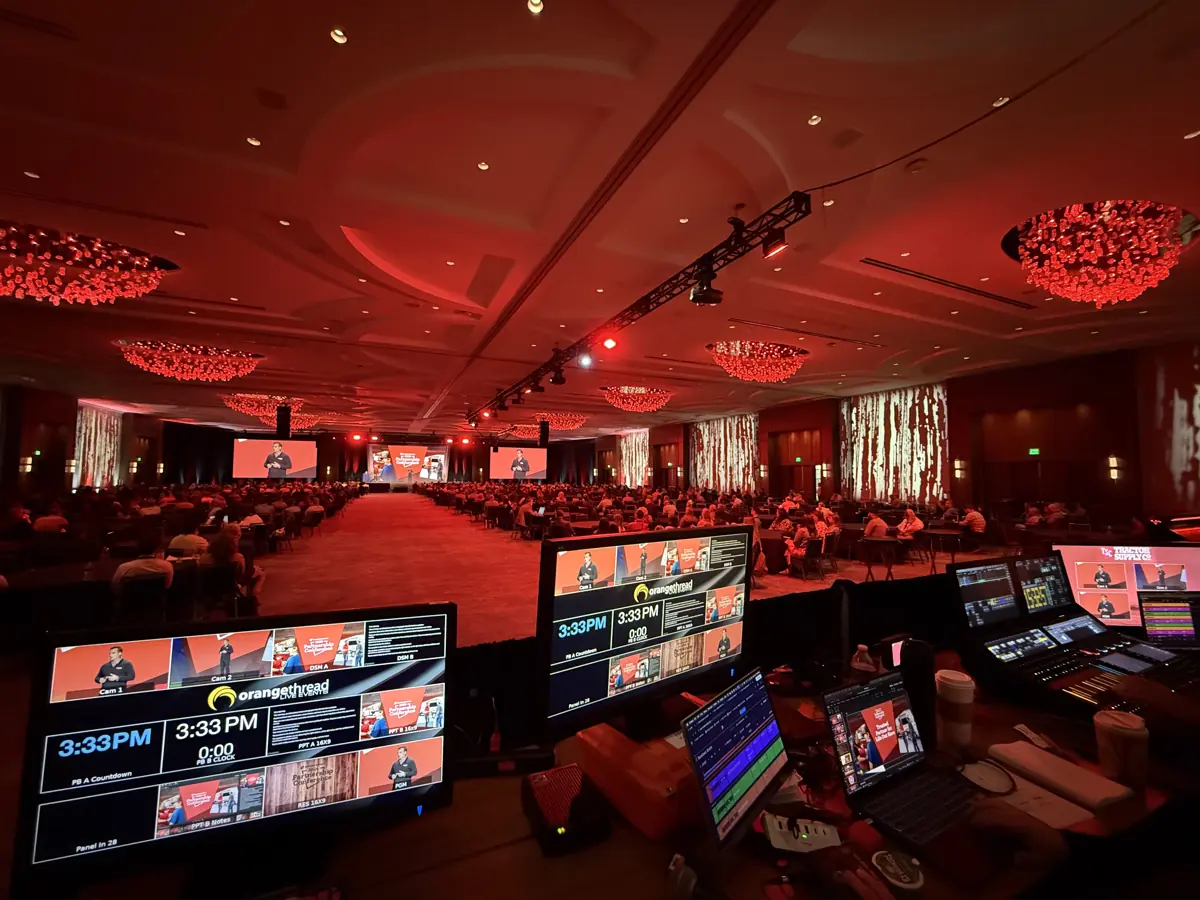 Orange Thread LIVE crew running audio and video control in a Gaylord ballroom