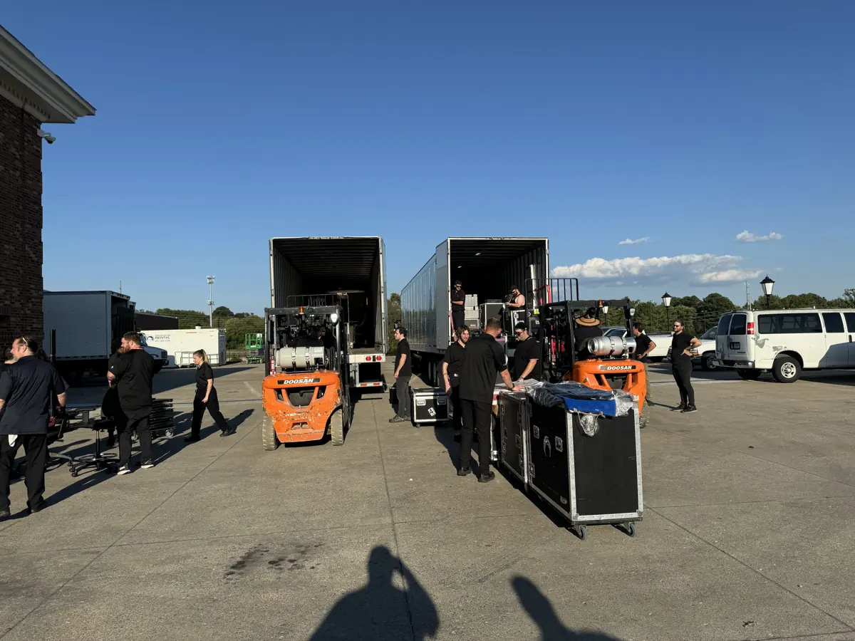 Orange Thread LIVE crew unloading road cases at a Gaylord Opryland loading pad