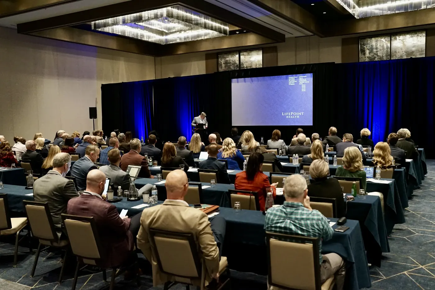 Audience seated in a JW Marriott Nashville ballroom facing the stage