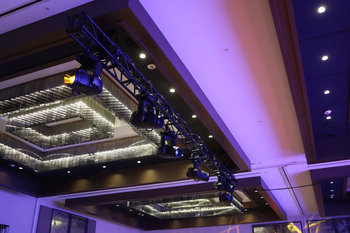 Truss and stage lighting rigged over a JW Marriott Nashville ballroom