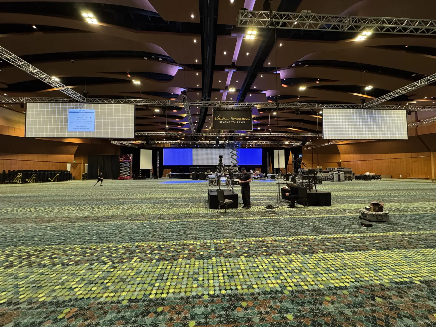 Truss, lighting and screens set in the Music City Center ballroom